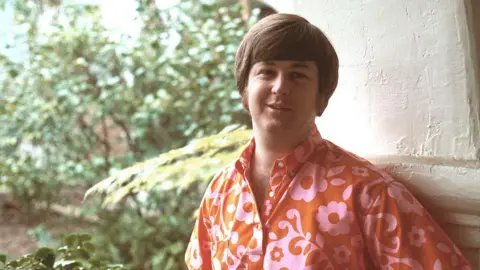 Getty Images Brian Wilson wearing a red shirt in an old photo