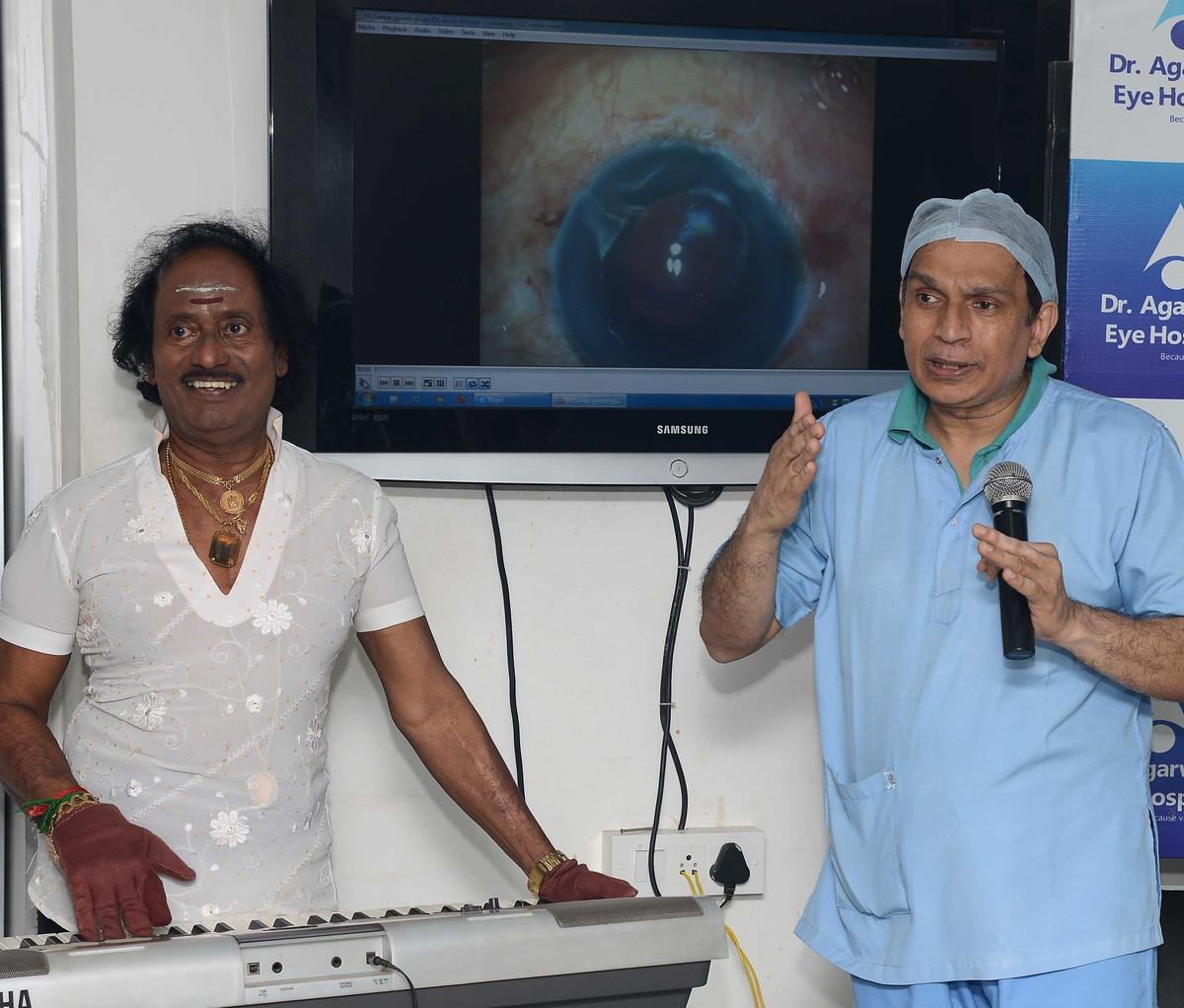Dr. Amar Agarwal (right) of Dr. Agarwal’s Eye Hospital with film music director Ganesh, after restoring the vision of the music director through an advanced surgical technique at the hospital, in Chennai on May 31, 2014