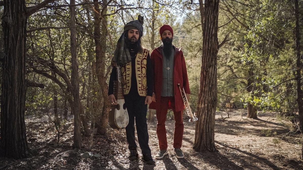 Qais plays the rabab, while Sonny plays the trumpet  