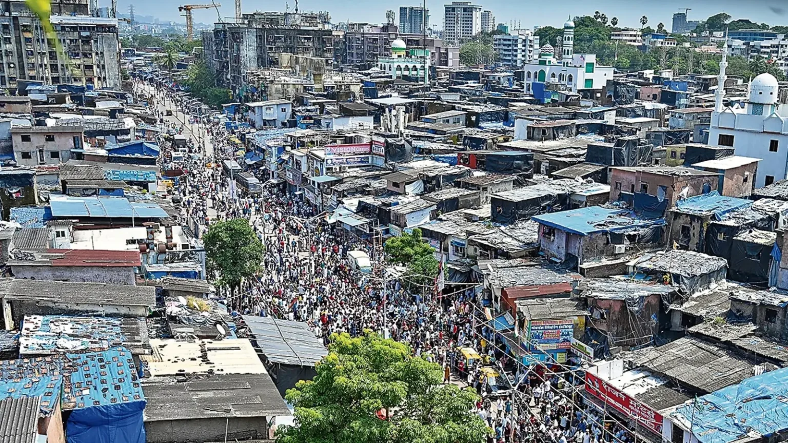Residents engaging in Dharavi Redevelopment Project survey activities near Kumbharwada
