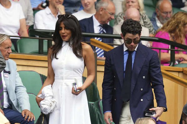 Actor Priyanka Chopra and her musician husband Nick Jonas arrive in the Royal Box at Centre Court during the Wimbledon Tennis Championships in London. (AP) Olivia Rodrigo, John Cena and other celebrities make their way to Wimbledon's Royal Box