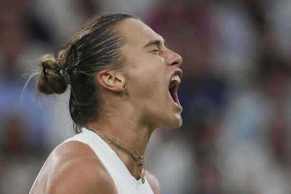 Aryna Sabalenka reacts after winning a point against Emma Raducanu during a third round women's singles match at Wimbledon. (AP) Wimbledon: No. 1 Aryna Sabalenka holds off home favorite Emma Raducanu at Centre Court